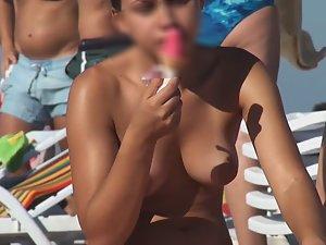 Topless chick eats an ice cream Picture 3
