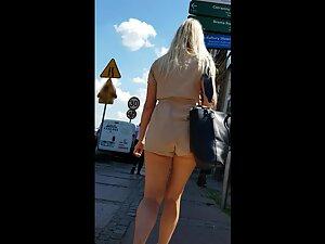 Big bag accidentally reveals a nice chunk of her butt Picture 3