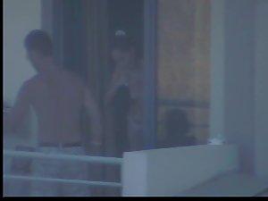 Quick glance of a topless girl on balcony Picture 2