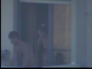 Quick glance of a topless girl on balcony Picture 3