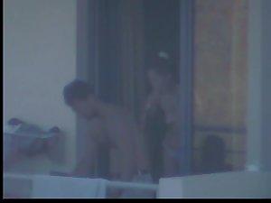 Quick glance of a topless girl on balcony Picture 4