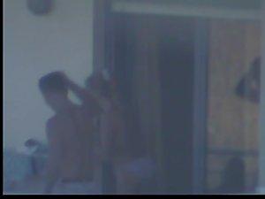 Quick glance of a topless girl on balcony Picture 6