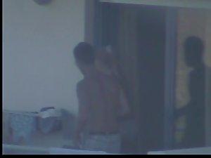 Quick glance of a topless girl on balcony Picture 7