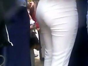 Dude leans on a sexy ass in white pants