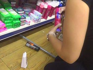 Store clerk bending over in front of me Picture 2