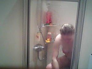 Spying on naked sister shaving her legs in shower Picture 1