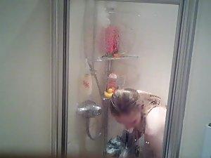 Spying on naked sister shaving her legs in shower Picture 4