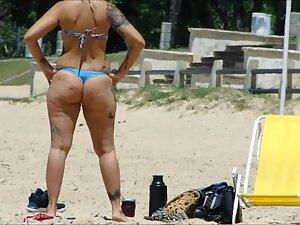 Tattooed girl's ass gets great shape when she crouches Picture 1
