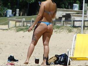 Tattooed girl's ass gets great shape when she crouches Picture 5