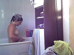 Spying on naked girl checking herself and showering Picture 6