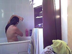 Spying on naked girl checking herself and showering Picture 7
