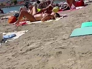 Making out while fingering her pussy on a public beach Picture 2