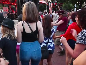 Hottie shakes her ass during a street concert