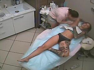 Tattooed vixen spied during hair removal treatment Picture 1