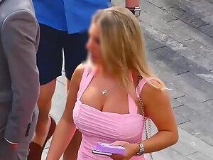 Shorty shows off big boobs in pink dress