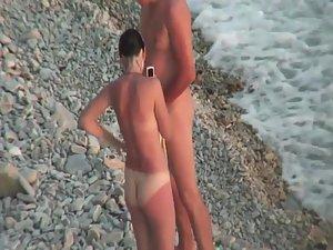 Sunburned woman is naked on a beach Picture 8