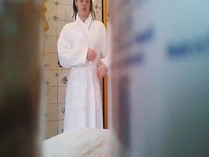 Petite girl peeped naked in bathroom