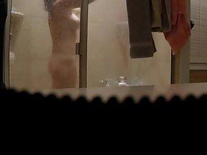 Spying her naked body and tramp stamp tattoo in shower Picture 2