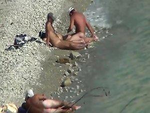 Two couples enjoying sex on a beach Picture 2