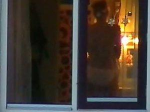 Direct peeping view through her window