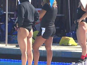 Sexy swimmer bends over by the pool Picture 1