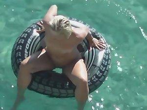 Nudist girl floats with her legs spread Picture 3