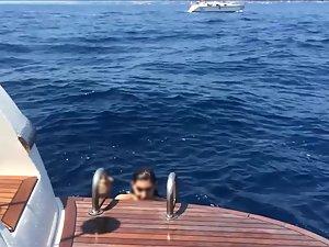 Happy girl enjoys being topless on a yacht Picture 6