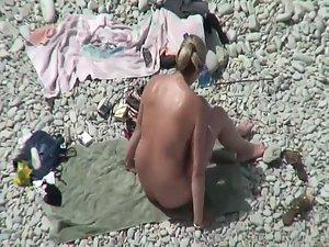 Nude milf on a beach and her hairy pussy Picture 7