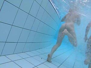 Voyeur swims near naked girls in swimming pool Picture 2