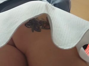 Butterflies tattoo on naked butt in upskirt