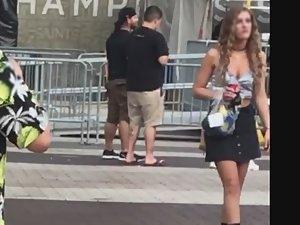 Curly haired girl in miniskirt and boots Picture 8