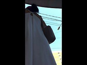 Transparent white thong of a fancy lady in upskirt Picture 1