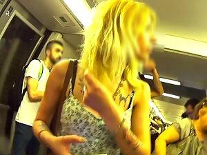 Upskirt of tattooed blonde beauty on train