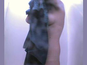 Mature lady showers in a beach cabin Picture 4