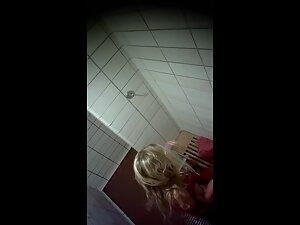 Spying on curvy blonde's tan lines in public shower Picture 1