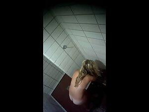Spying on curvy blonde's tan lines in public shower Picture 7