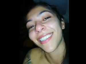 Fun girl smiles while she gives blowjob in the car