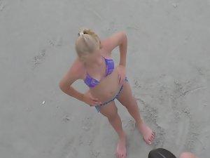 Teen in bikini flapping her arms Picture 2