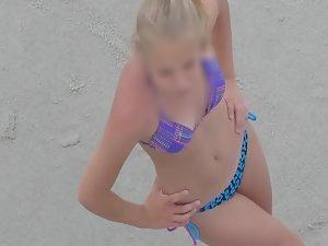 Teen in bikini flapping her arms Picture 3