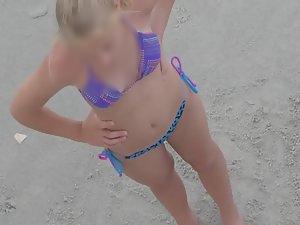 Teen in bikini flapping her arms Picture 7