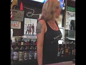 Busty waitress on candid camera across the counter Picture 1