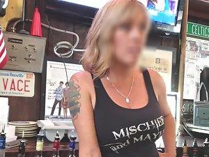 Busty waitress on candid camera across the counter