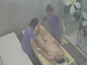 Spying on rich woman getting a four hand massage Picture 2