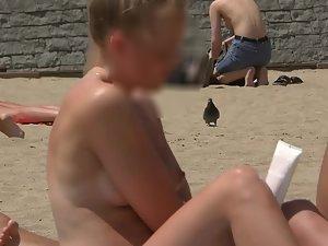 Topless blonde with hard nipples on the beach Picture 4