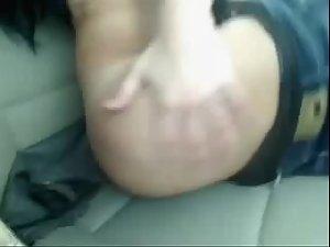 Elegant brunette shows her body in a car Picture 6
