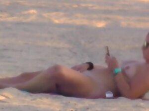 Nudist girl got caught while rubbing pussy on beach