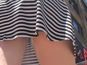 Fine tight ass in upskirt under those stripes Picture 2