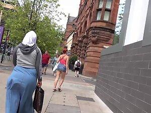 Sexy redhead keeps pulling her miniskirt down Picture 6