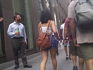 Bag gets stuck on shorts and reveals ass cheek
