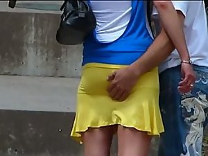Boy gropes girlfriend's ass in a miniskirt